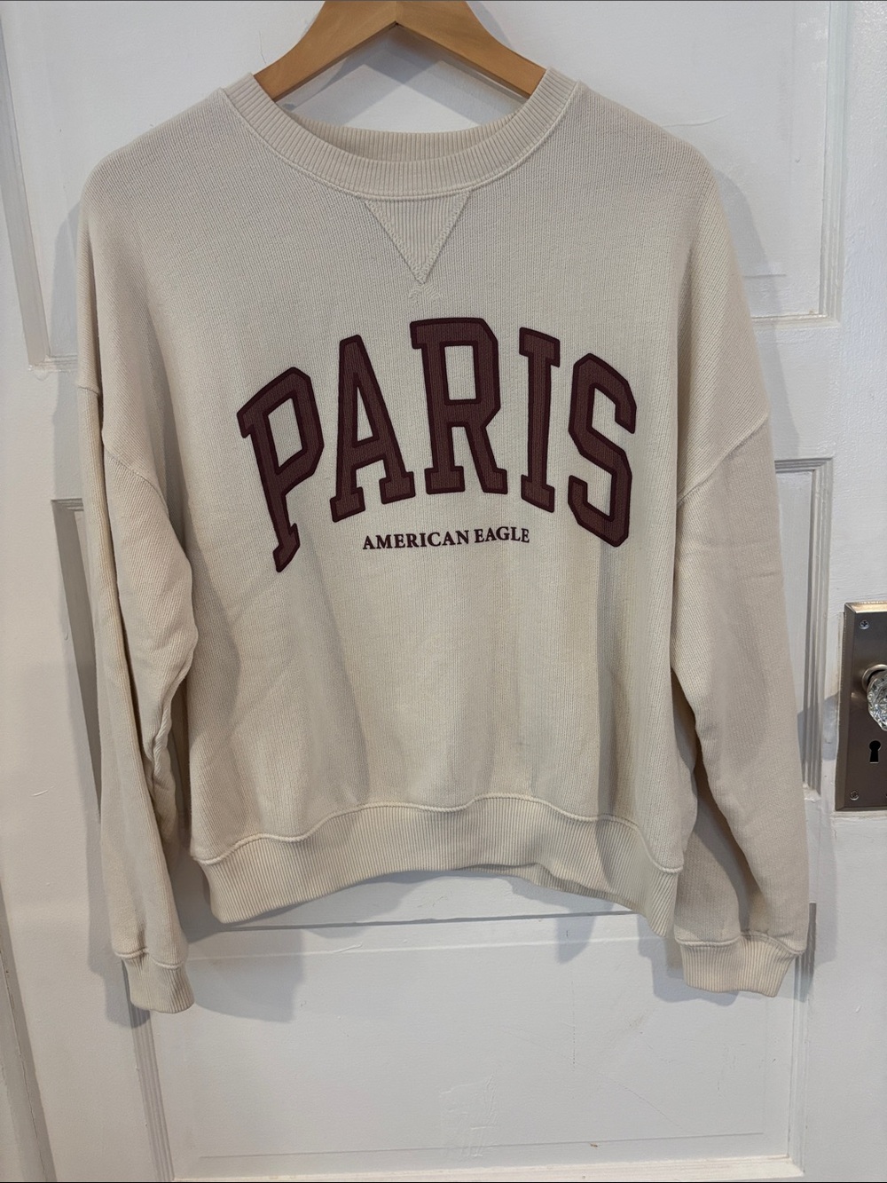 American Eagle Outfitters Cream Crewneck Sweatshirt with Burgundy PARIS Appliqué